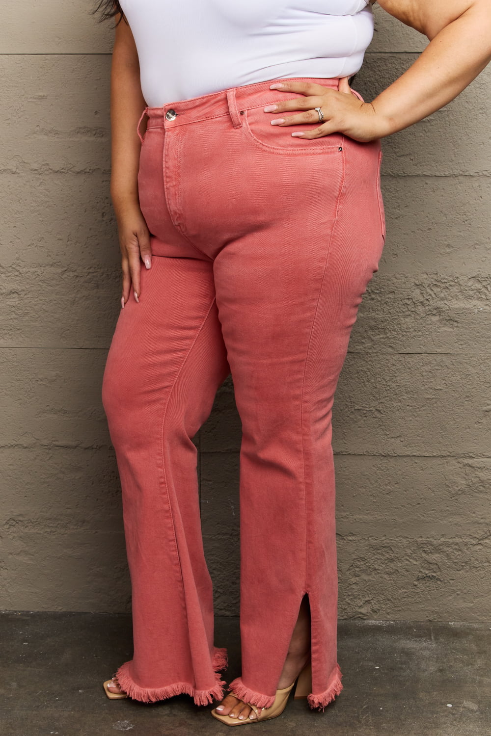 RISEN Bailey High Rise Raw Side Slit Hem Flared Leg Pink Denim Jeans